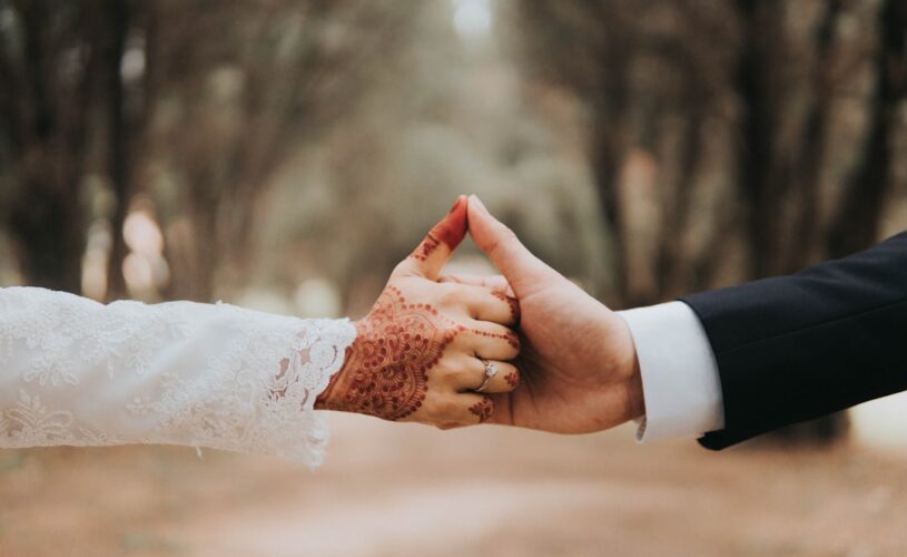 Man and woman holding hands